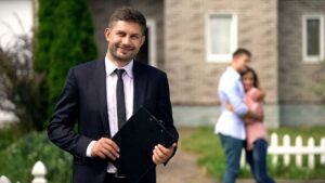 Homeowner reviews repair records and a checklist at a kitchen table before listing a house.